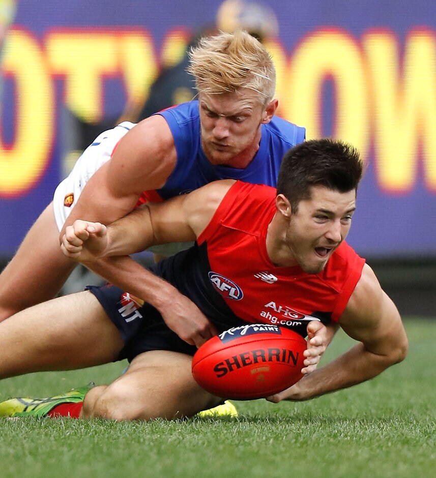 AFL 2016 Rd 09 - Melbourne v Brisbane MELBOURNE, AUSTRALIA - MAY 22: Alex Neal-Bullen of the Demons is tackled by Nick Robertson of the Lions during the 2016 AFL Round 09 match between the Melbourne Demons and the Brisbane Lions at the Melbourne Cricket Ground on May 22, 2016 in Melbourne, Australia. (Photo by Michael Willson/AFL Media)